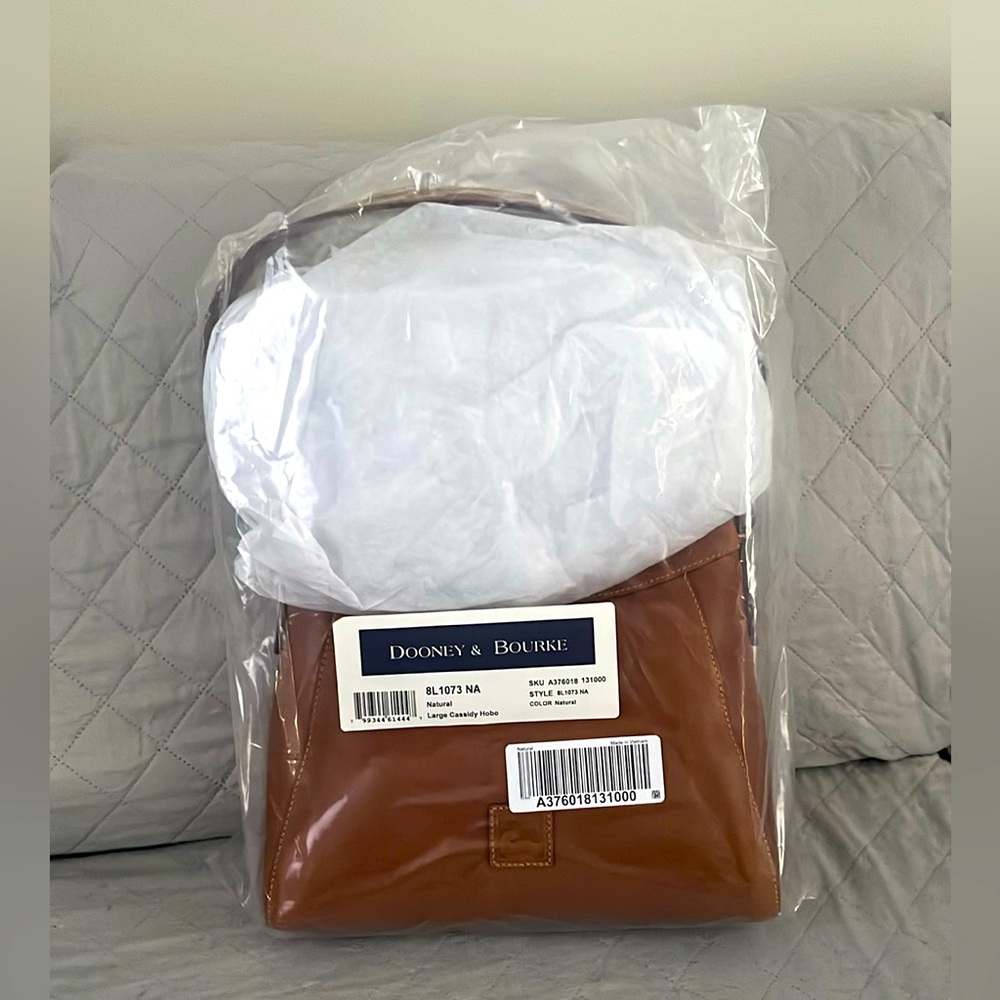 Dooney&Bourke hobo style purse, brand new with tags original package